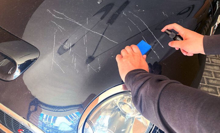 NuraFix nano spray applied to car paint — filling scratches and revitalizing paint